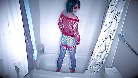 Latina with a large dildo is playing with it in the shower