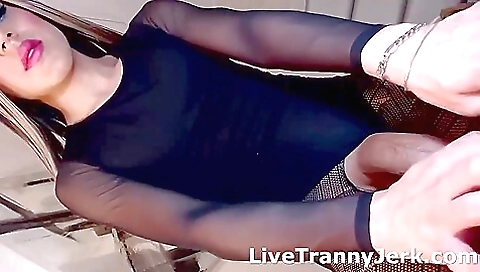 Beautiful teen in lingerie with a big cock is standing