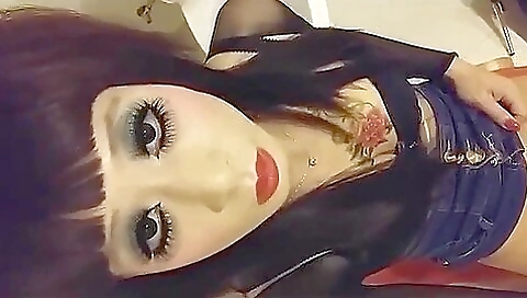 Sexy brunette is with a dildo in her pussy and ass