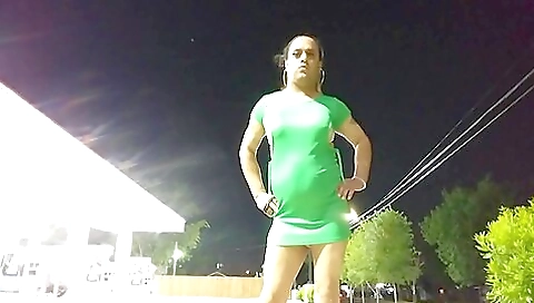 Bianca is showing off her body in her transvestite outfit outdoors